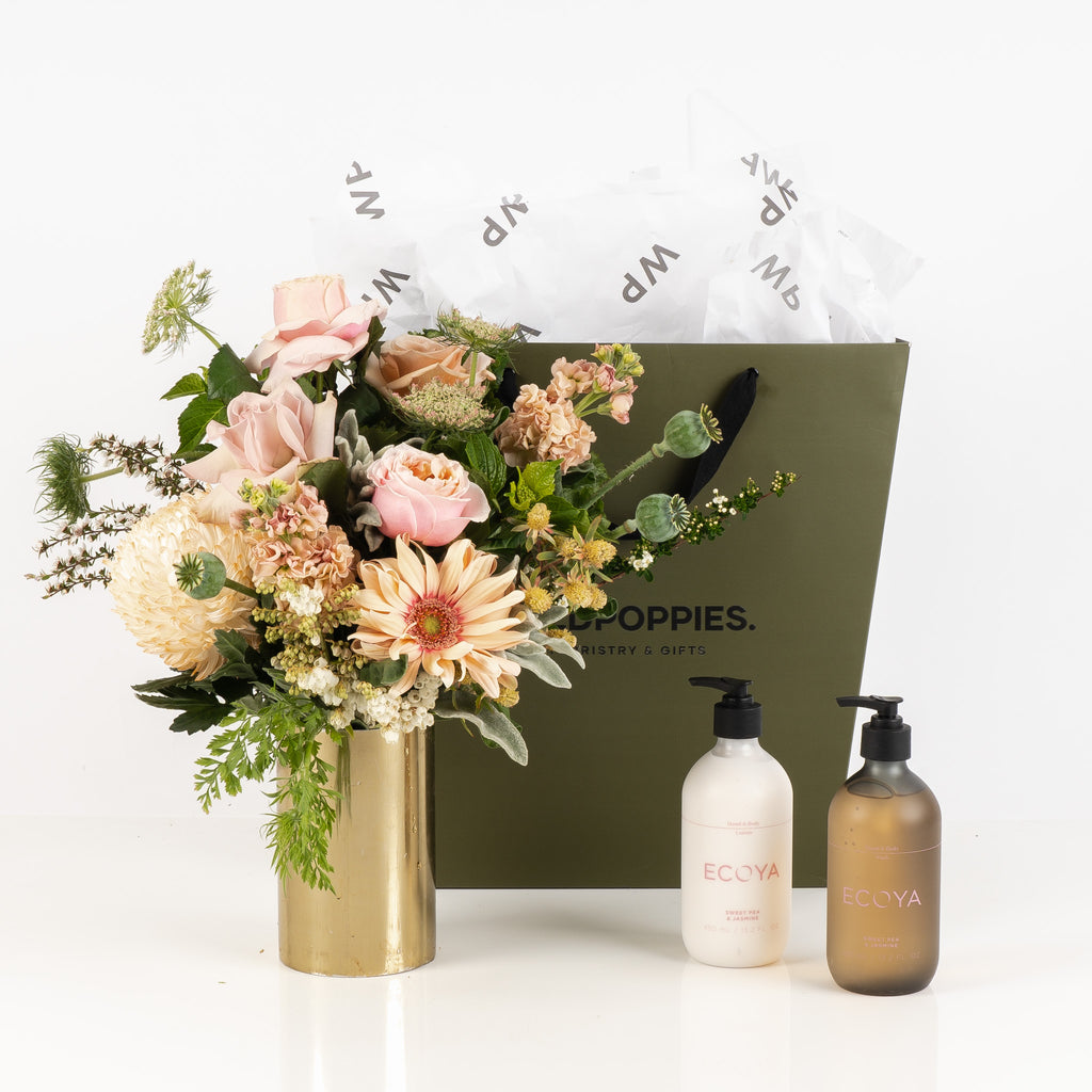 "A Moment for You" Gift Set featuring a fresh pastel posy, Ecoya Sweet Pea and Jasmine hand and body lotion, and hand and body wash. Elegantly presented in a premium Wild Poppies gift bag with satin ribbon, offering a luxurious and relaxing self-care experience for any occasion.