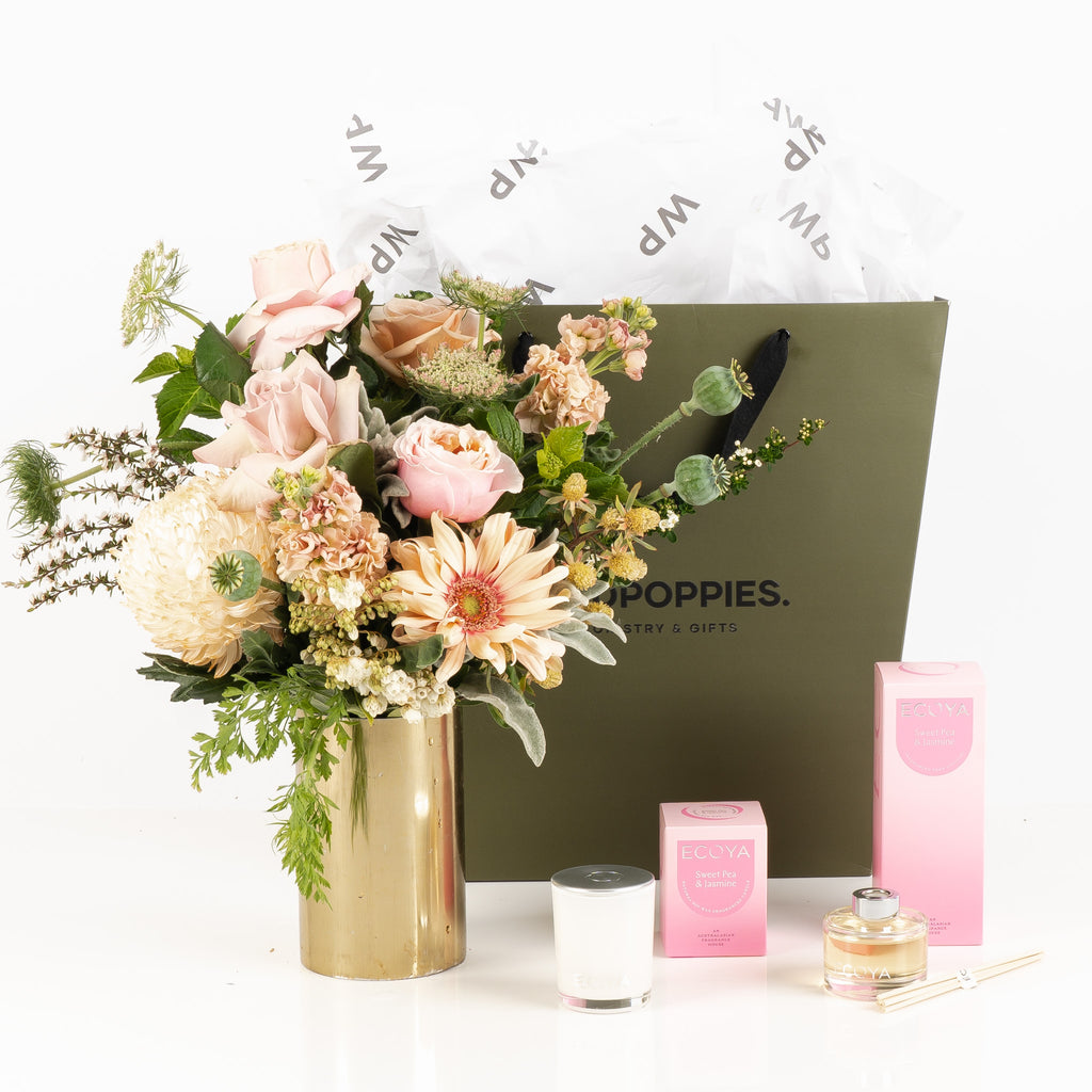 "Sweet Pea Petal Gift Set" featuring a fresh pastel posy, Ecoya Sweet Pea & Jasmine diffuser, and scented candle. Presented in a premium Wild Poppies gift bag with satin ribbon and tissue paper, this elegant set creates a serene and inviting atmosphere, perfect for celebrating any occasion.